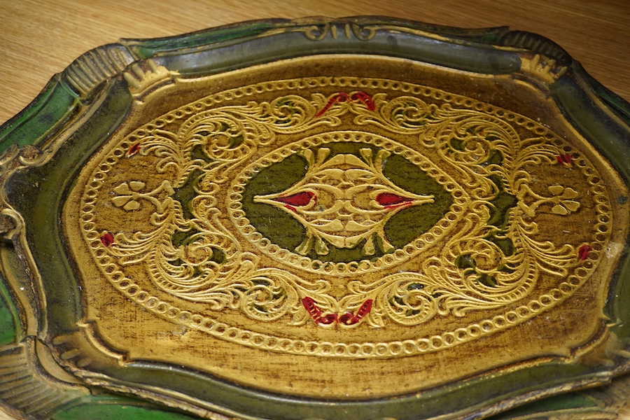 Five Venetian trays, three carved and painted wood examples, largest 57cm wide